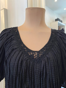 Black pleated tent dress with crotchet v-neck