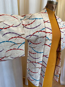 Abstract buttercream kimono with intricate inner lining pattern