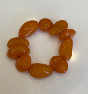 Orange pebble-like bracelet