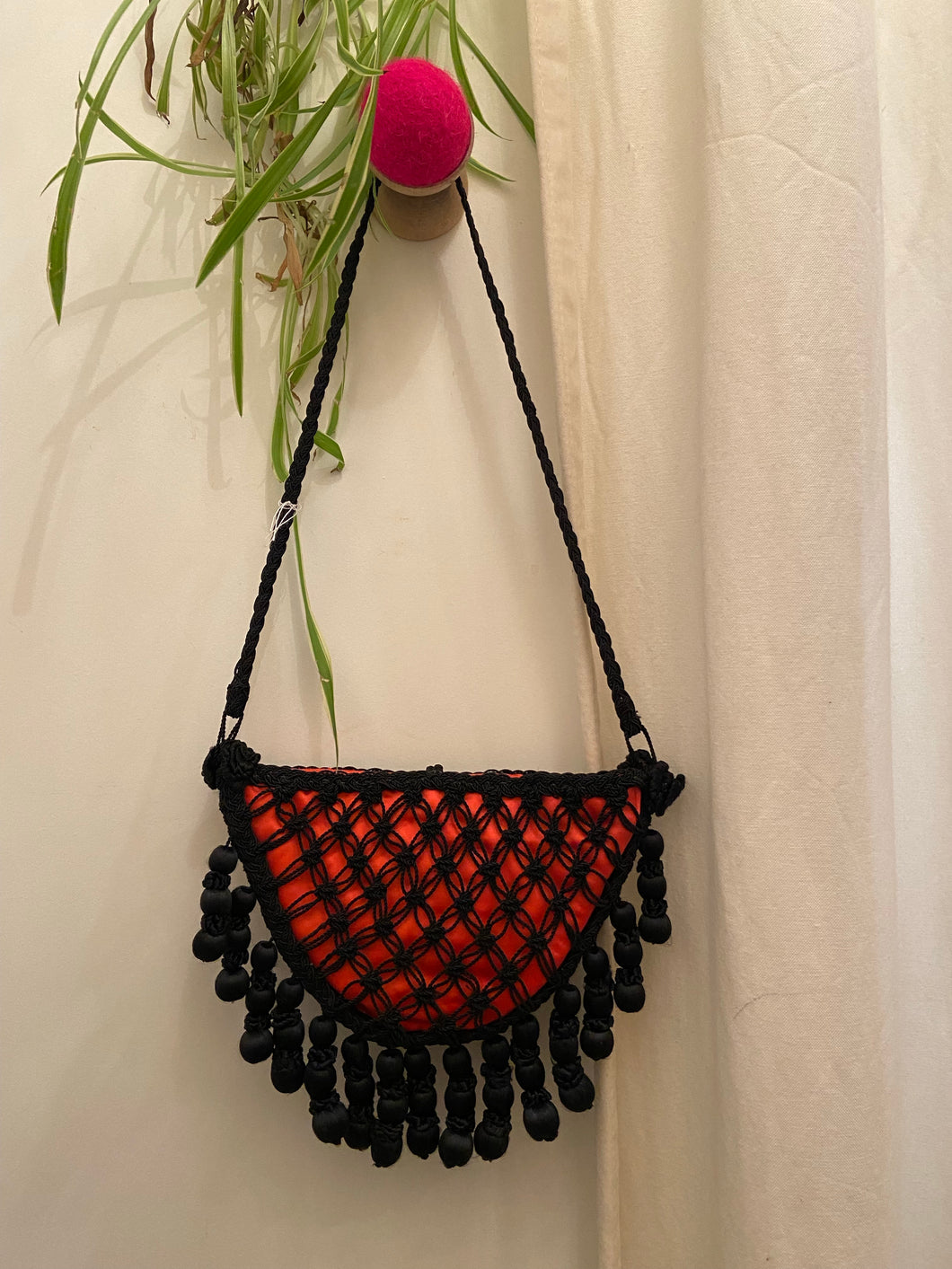Vintage red and black crocheted pocket bag with tassels