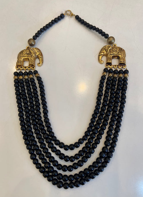 Black beaded necklace with gold elephants